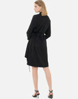 Redefine your wardrobe with this fashionable and unique black shirt dress, showcasing a waist-tie accent, irregular hem, and front ruffle paneling.