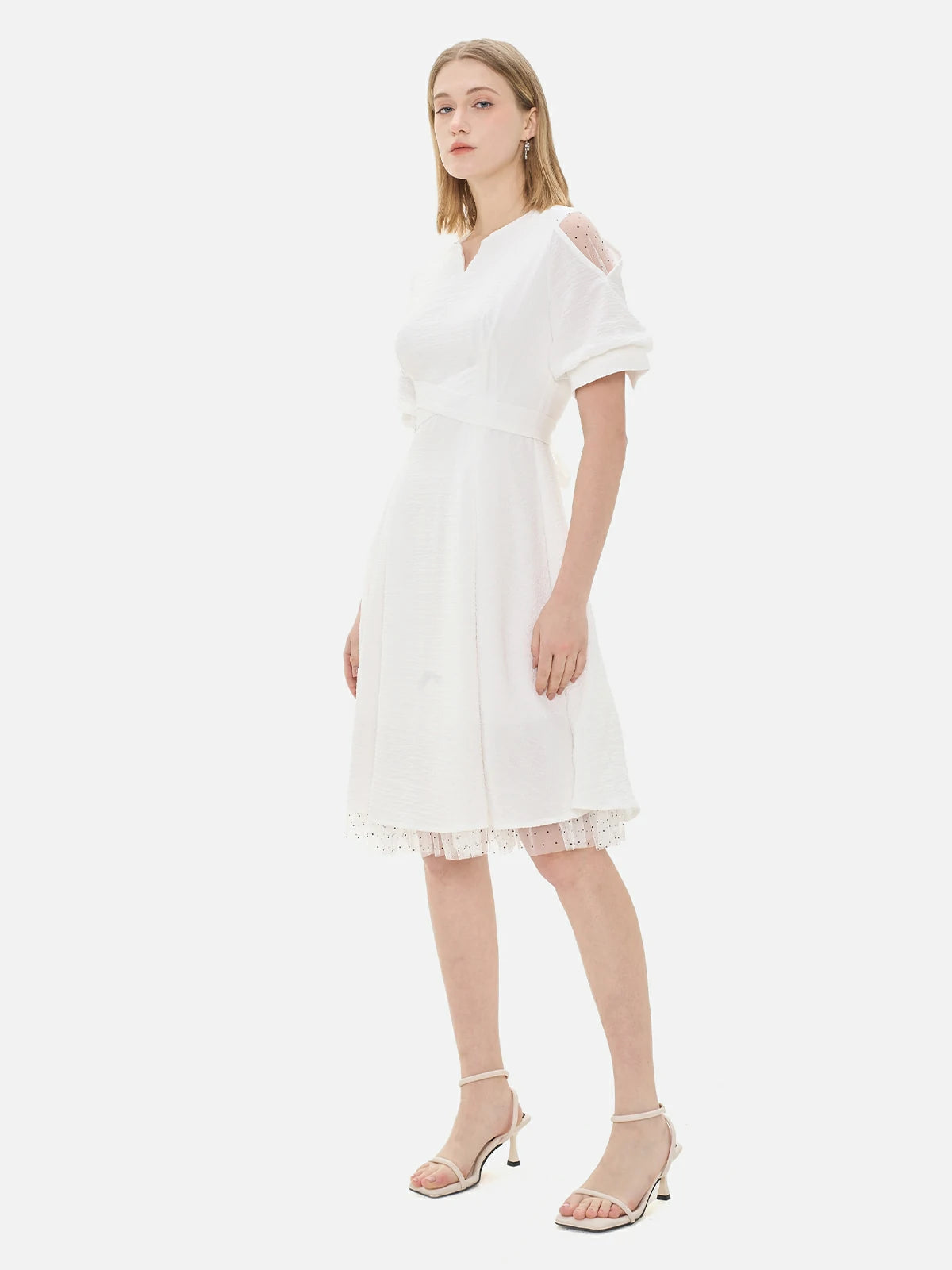 S·DEER white dress with structured puff sleeves and a soft A-line silhouette, ideal for day events