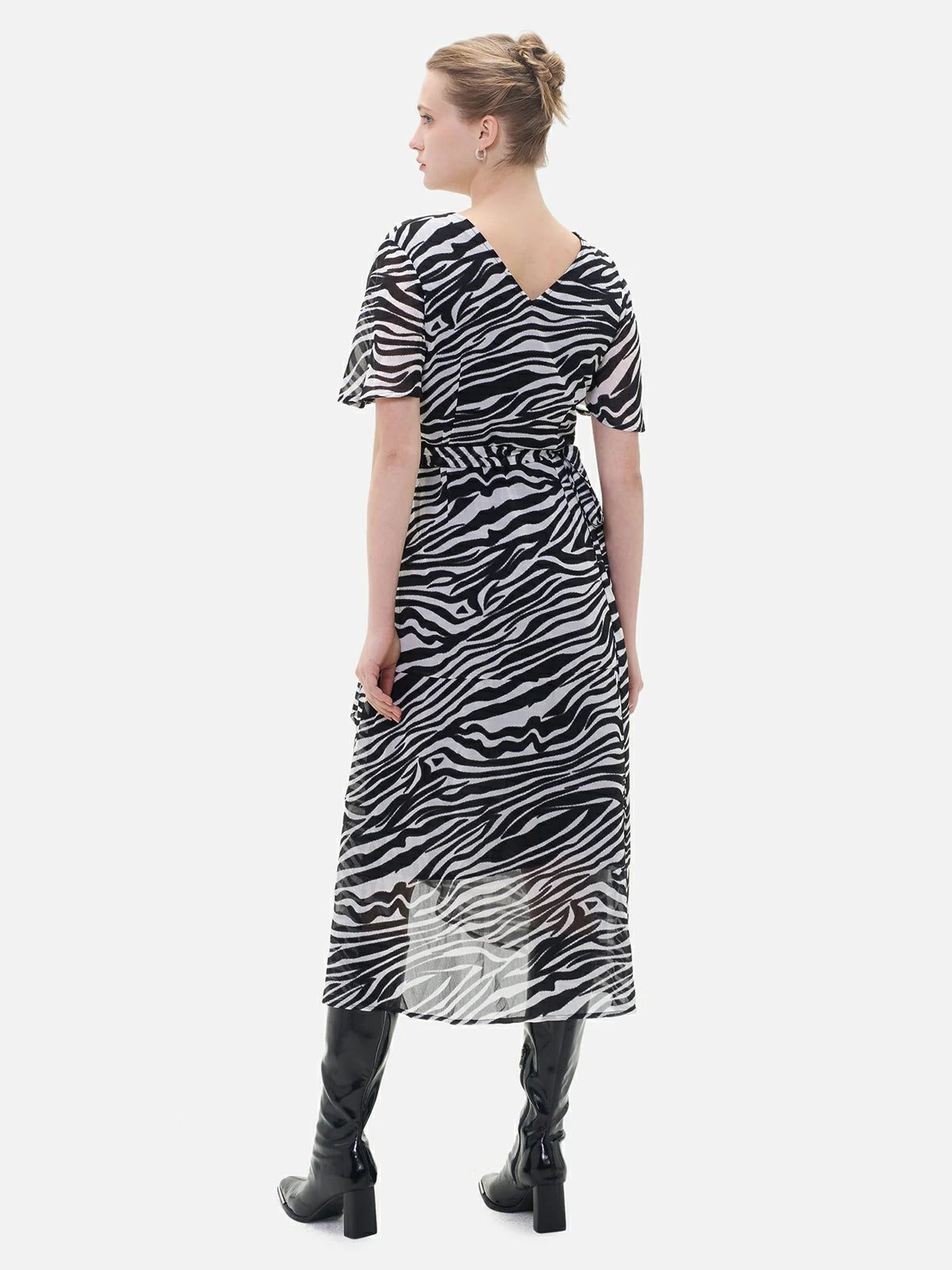 S·DEER zebra print dress with sleek, modern design and flattering drape, adding a playful yet sophisticated touch to evening wear