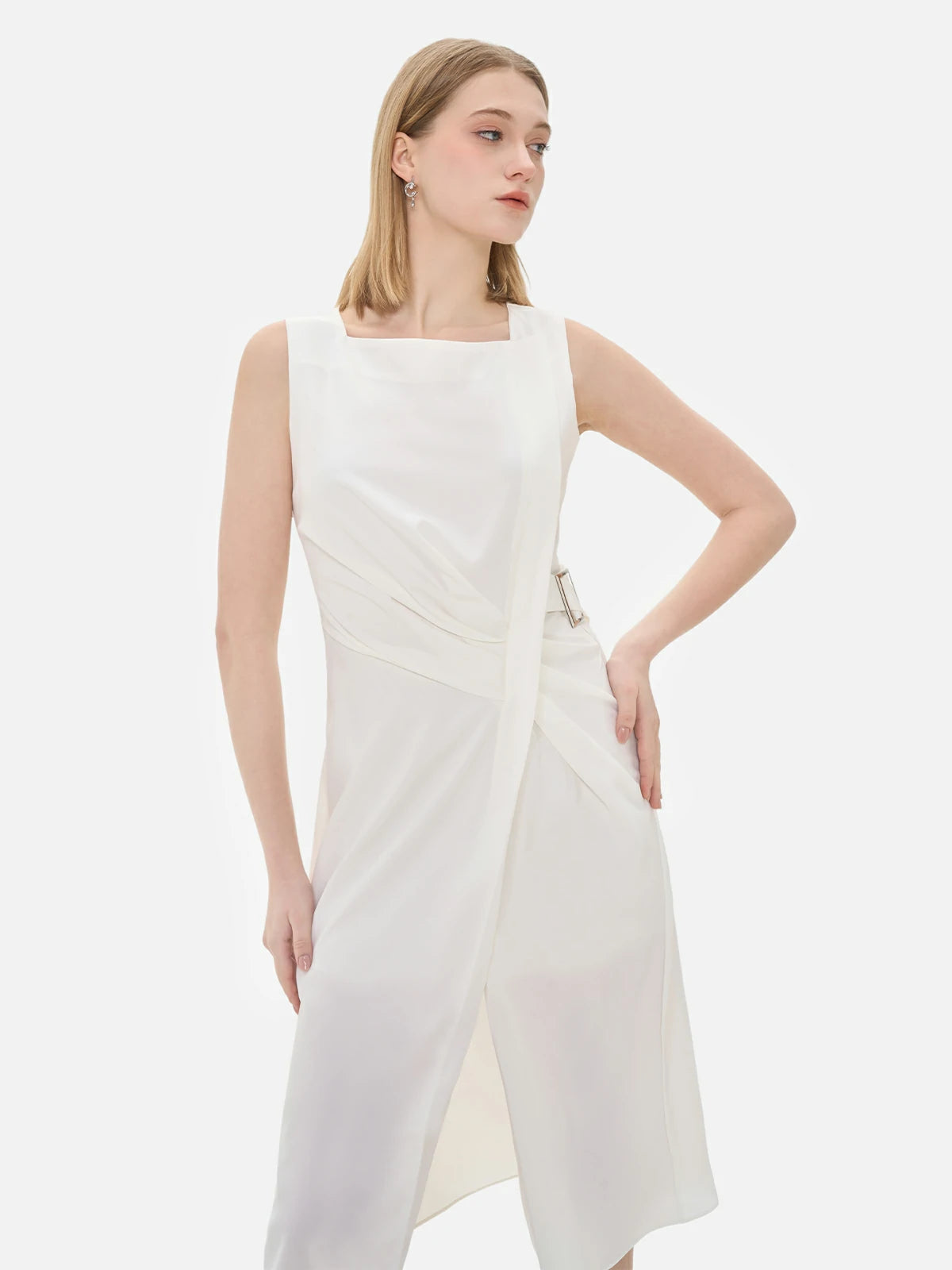 White dress with a square neckline, asymmetric design, and waist belt, perfect for evening events