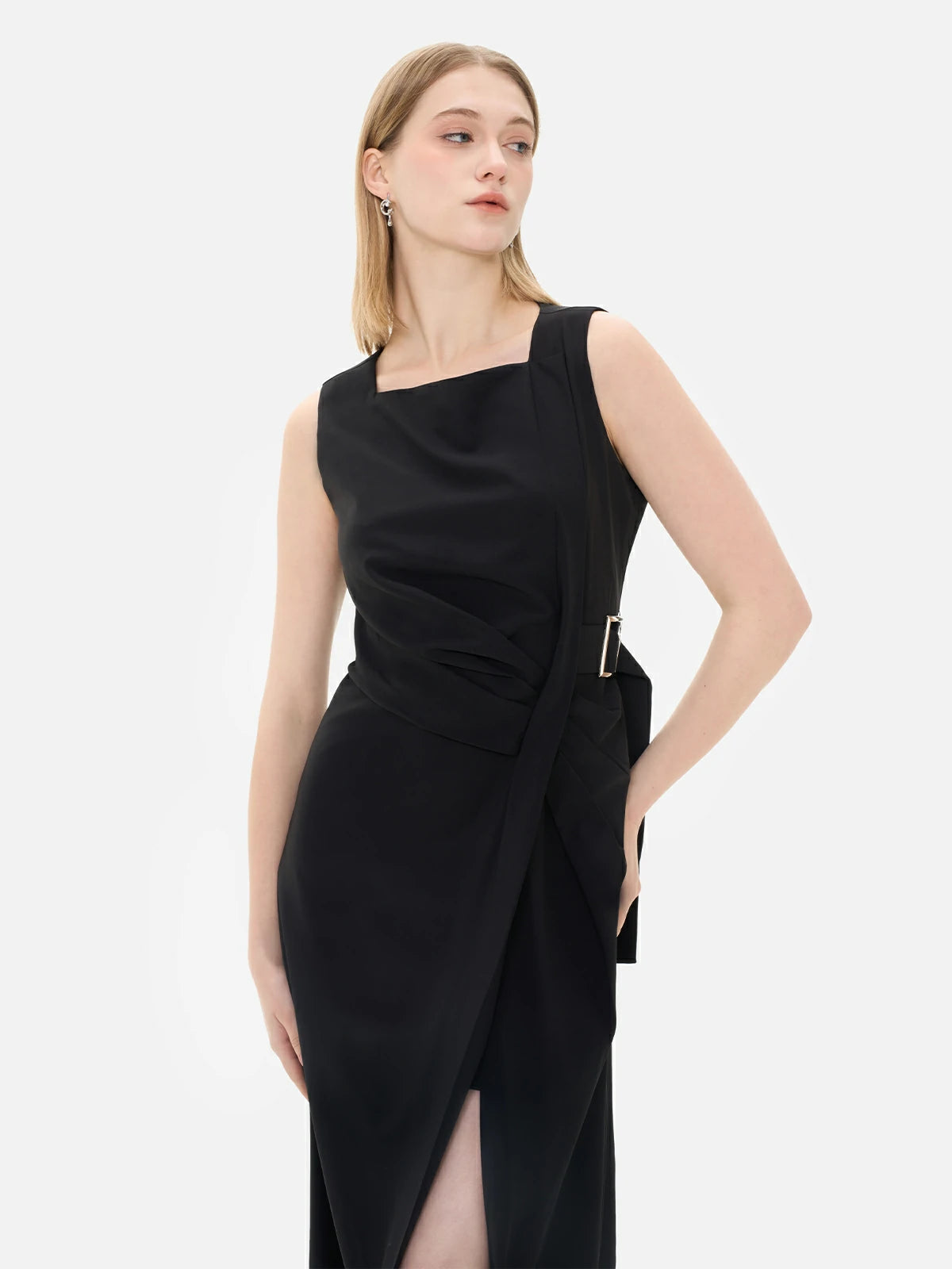 black dress with a square neckline, asymmetric design, and waist belt, perfect for evening events