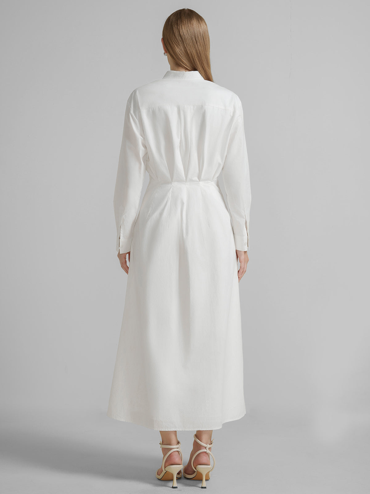 S·DEER white shirt dress, highlighting the simple yet sophisticated design