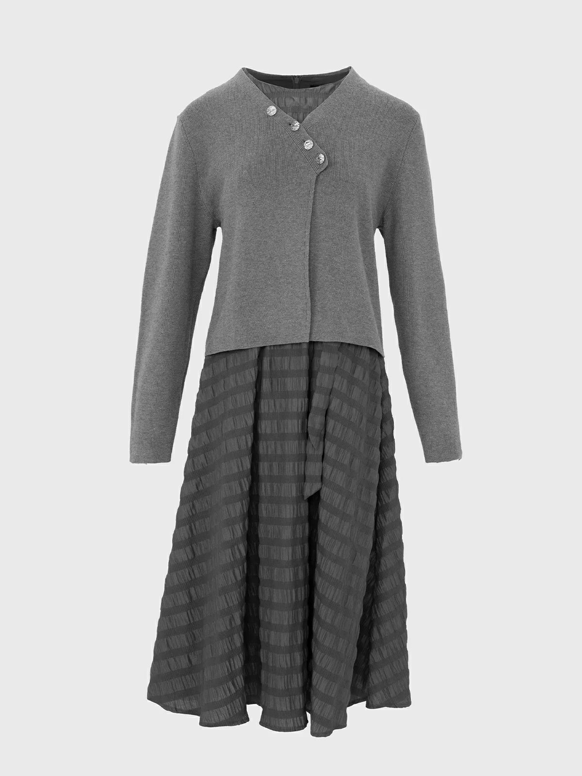 Define your fashion statement with this distinctive two-piece set, highlighting an irregular buttoned cardigan and a sleeveless A-line dress featuring a striped texture.