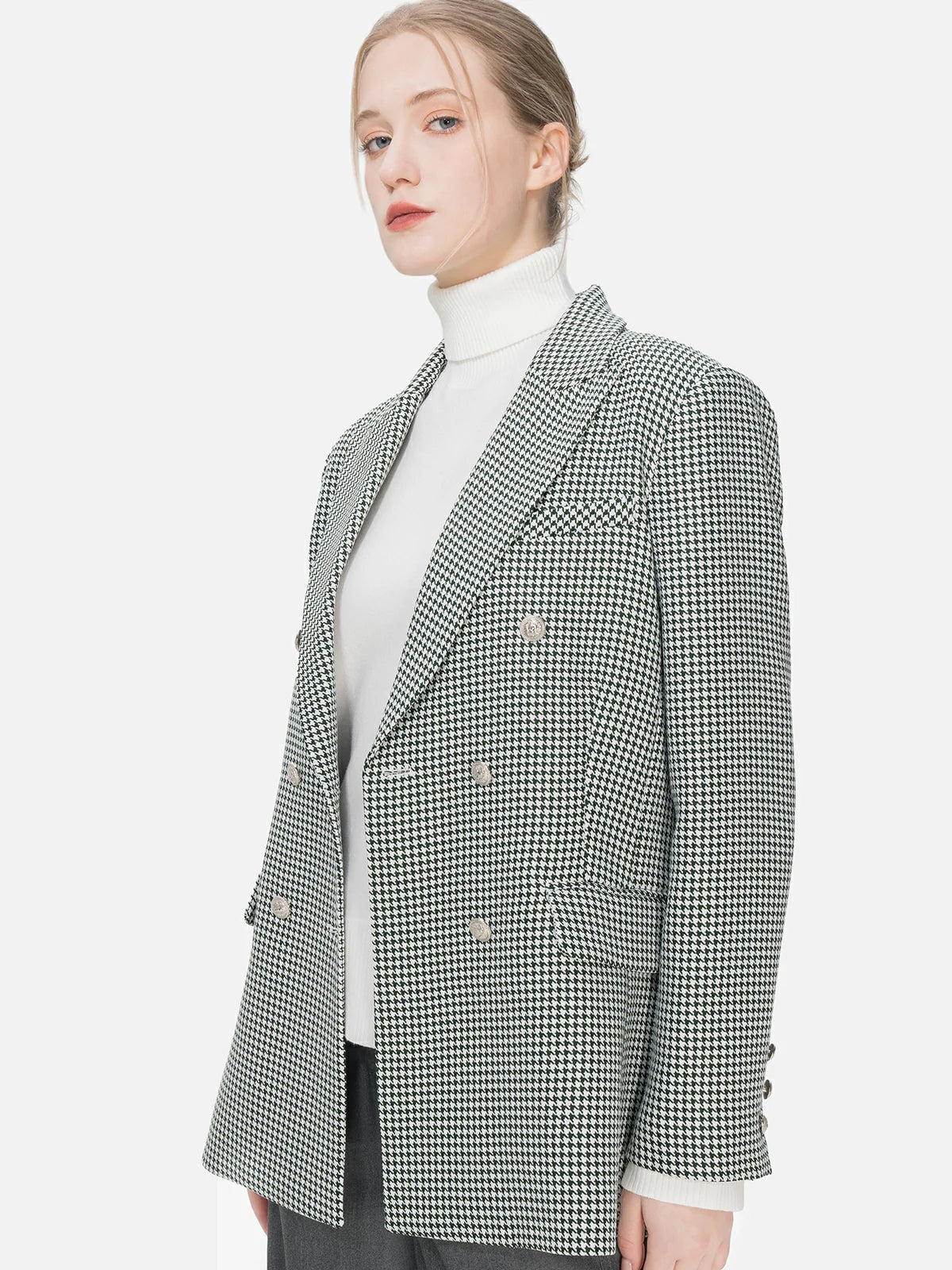 Make a fashion statement with this meticulously tailored green-toned houndstooth blazer, showcasing padded shoulders and a double-breasted design.
