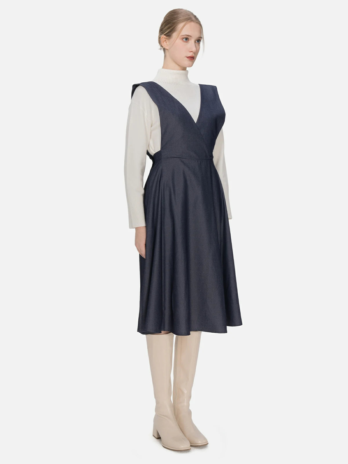 Versatile V-neck overall dress featuring an elastic waist design, tailored cut, and overall strap detail, ensuring a snug fit and an elegant silhouette suitable for diverse settings.