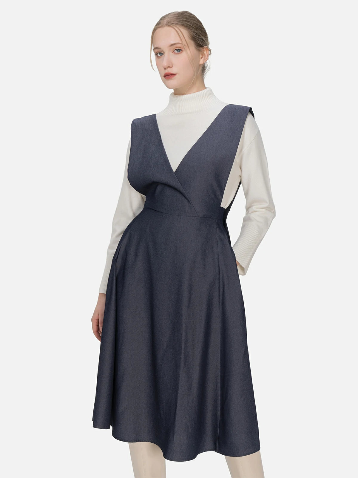 Tailored V-neck overall dress with an elastic waist design, overall strap detail, and versatile fashion, providing a snug fit and an elegant silhouette adaptable to different occasions.