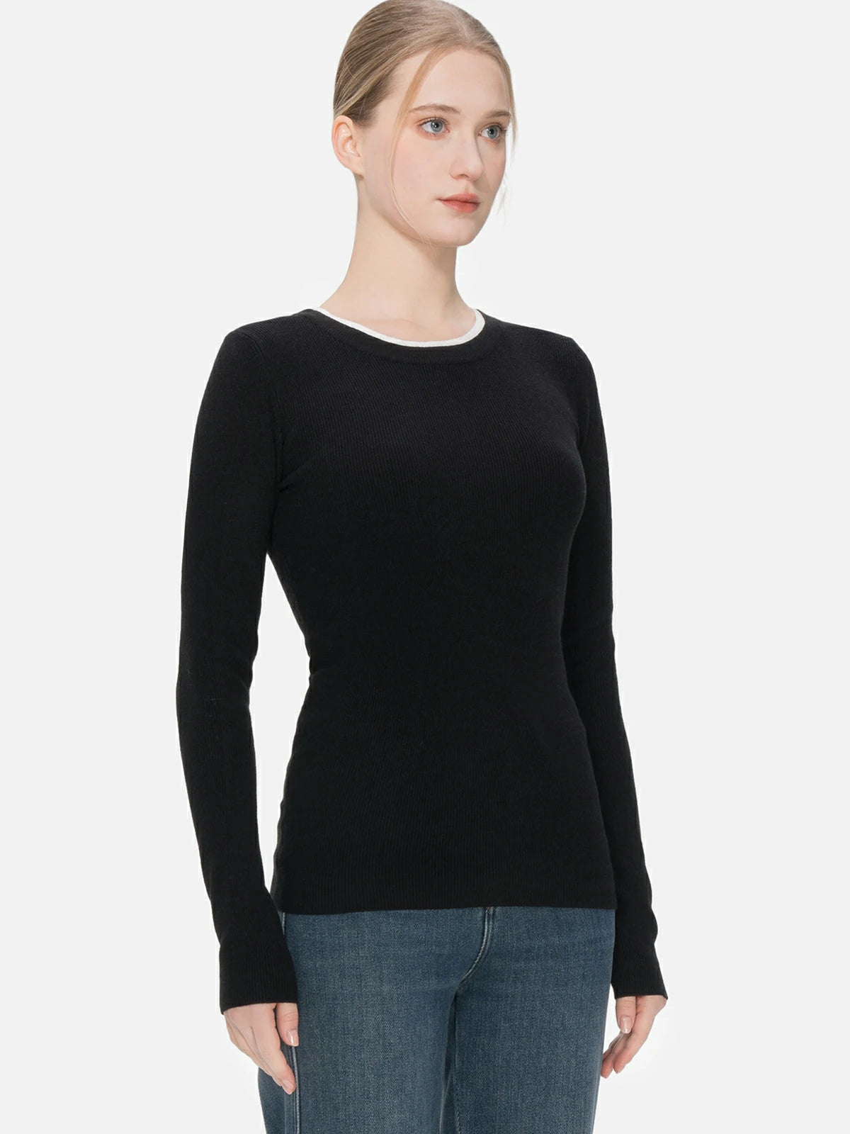 Minimalist and understated luxury in the black knit sweater