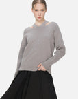 Pullover sweater featuring a forward-thinking and avant-garde aesthetic