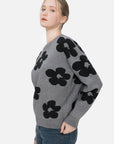 Casual and comfortable gray sweater featuring a loose-fit design and charming floral print