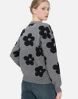 Embrace natural grace with a gray floral-print sweater in a loose and comfortable fit