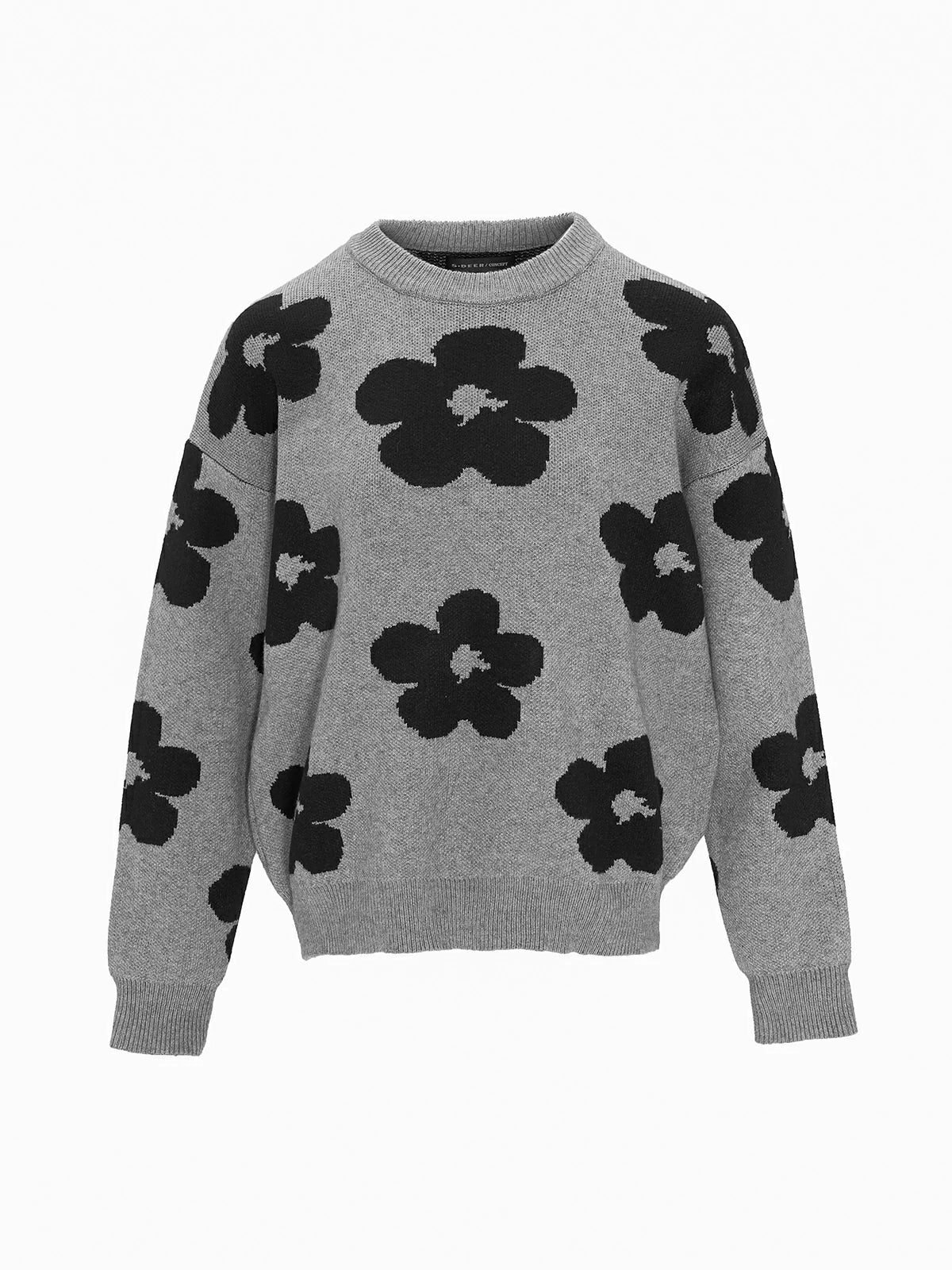 Explore endless styling possibilities with a loose-fit gray sweater adorned with a charming floral print.