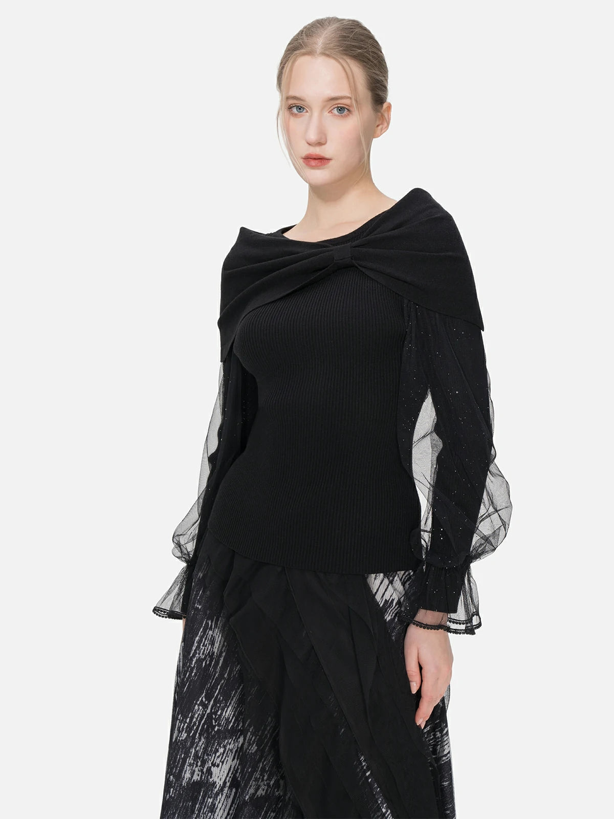 Feminine charm is embodied in this fitted sweater with a one-shoulder bow shawl and splice tulle sleeves, creating an elegant and sophisticated look.