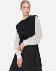 Versatile chic attire: black knitted main body paired with white chiffon sleeves and a side-tie design.