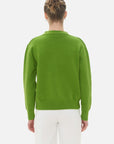 Stylish and comfortable green V-neck cardigan with various pairing options.