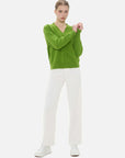 Green V-neck cardigan with front button design.