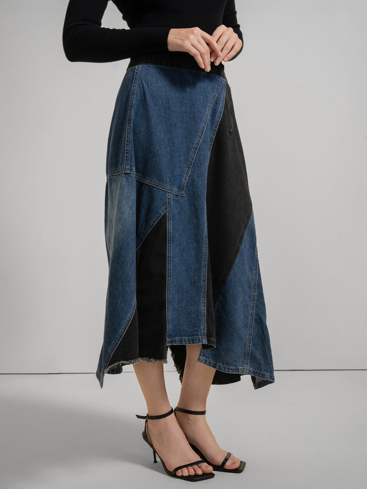 Women&#39;s patchwork denim midi skirt with asymmetrical hem, geometric blue and black panels, and side zipper detail, chic and stylish