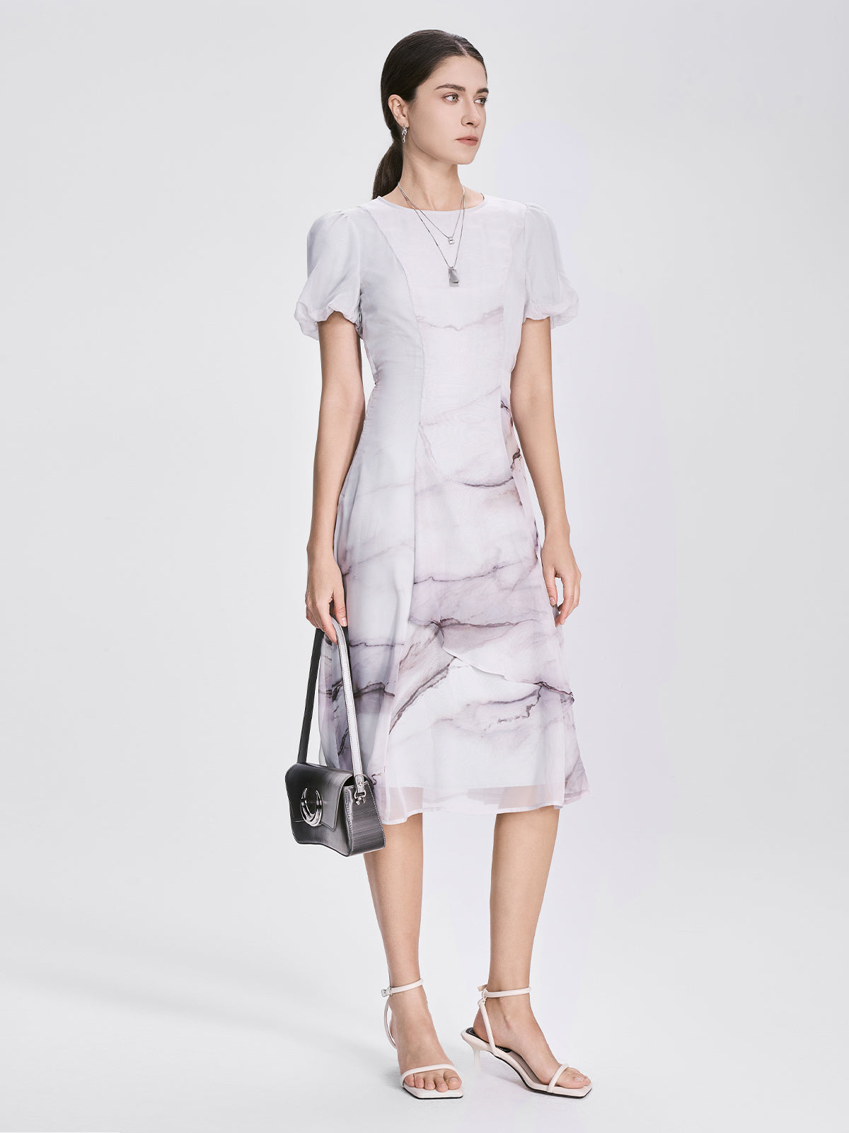 S·DEER marble-print dress showcasing its soft chiffon fabric, delicate puff sleeves, and flattering A-line silhouette, ideal for semi-formal occasions