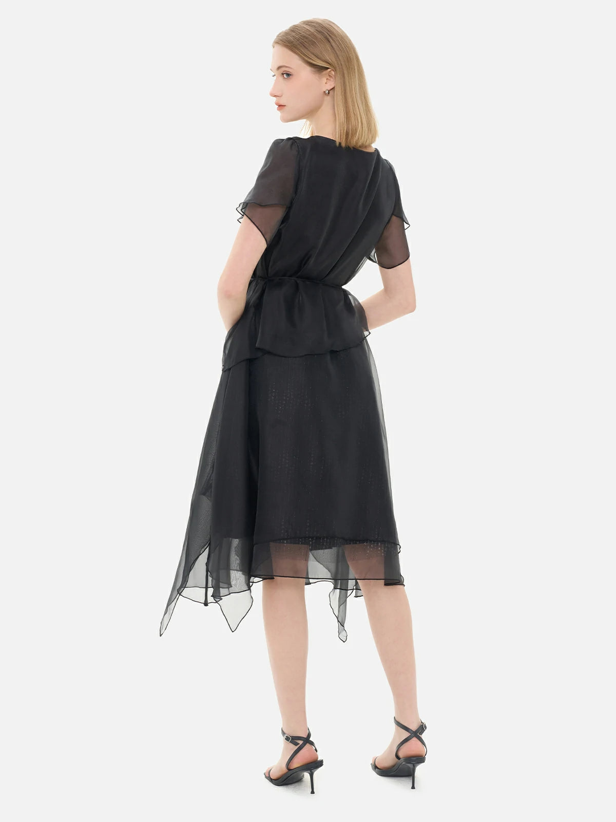 Back view of S·DEER black sheer chiffon dress with soft ruffled layers, creating an ethereal and sophisticated silhouette
