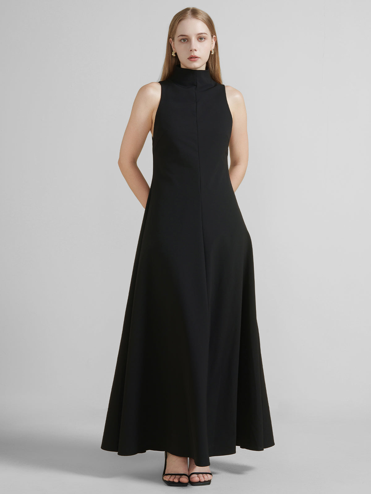S·DEER black sleeveless dress, showcasing the smooth flow and refined fit