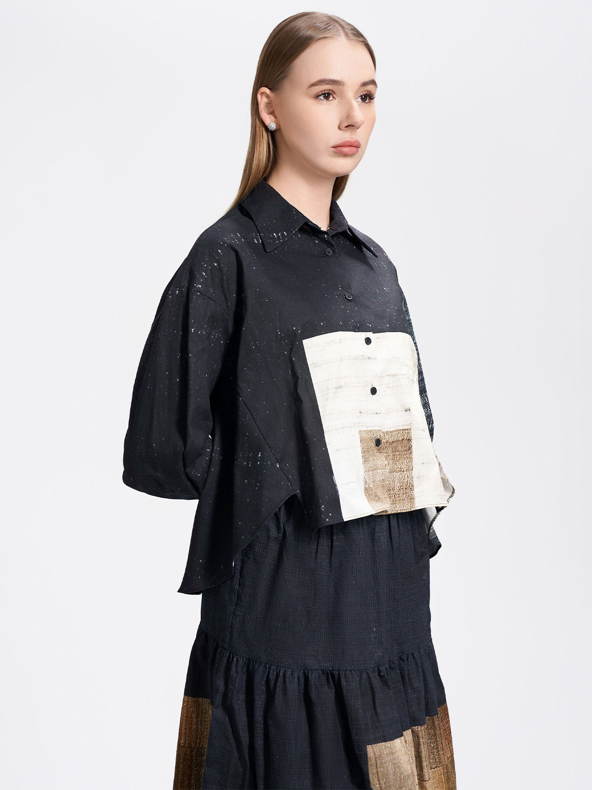 Unique color-block cropped blouse with long sleeves, crafted from textured fabric for a contemporary artistic look