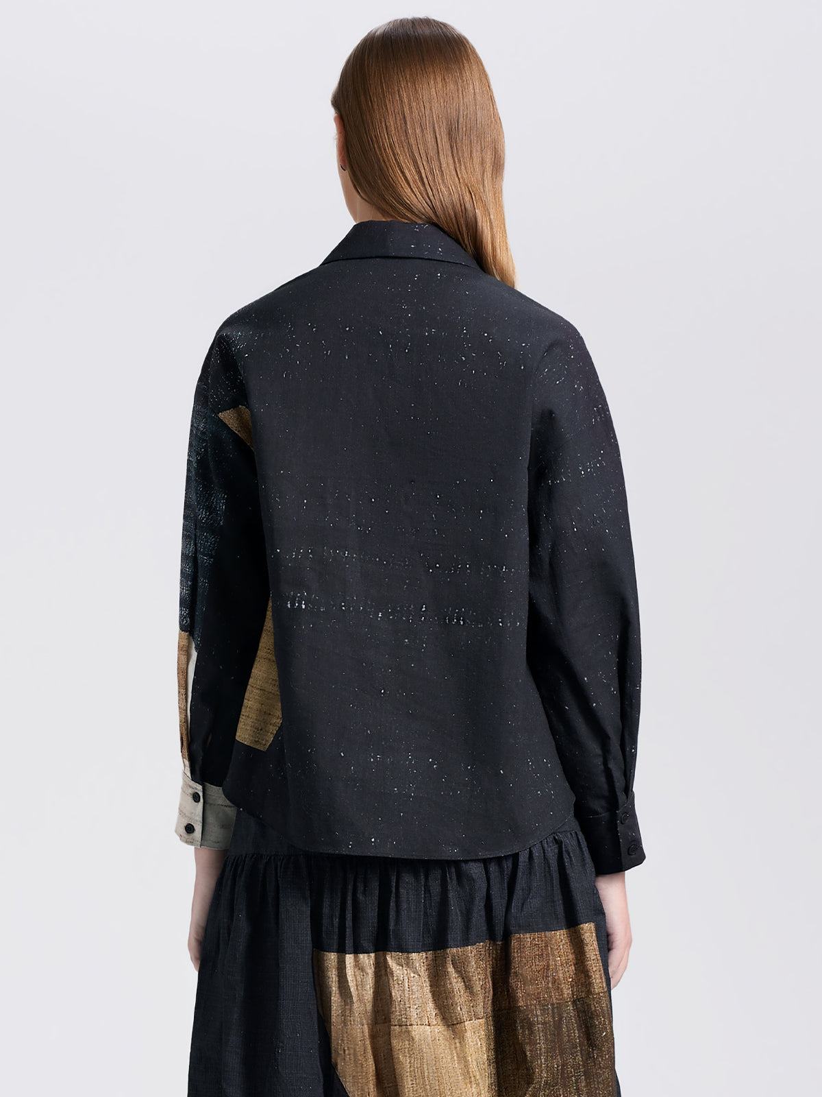 Unique color-block cropped blouse with long sleeves, crafted from textured fabric for a contemporary artistic look