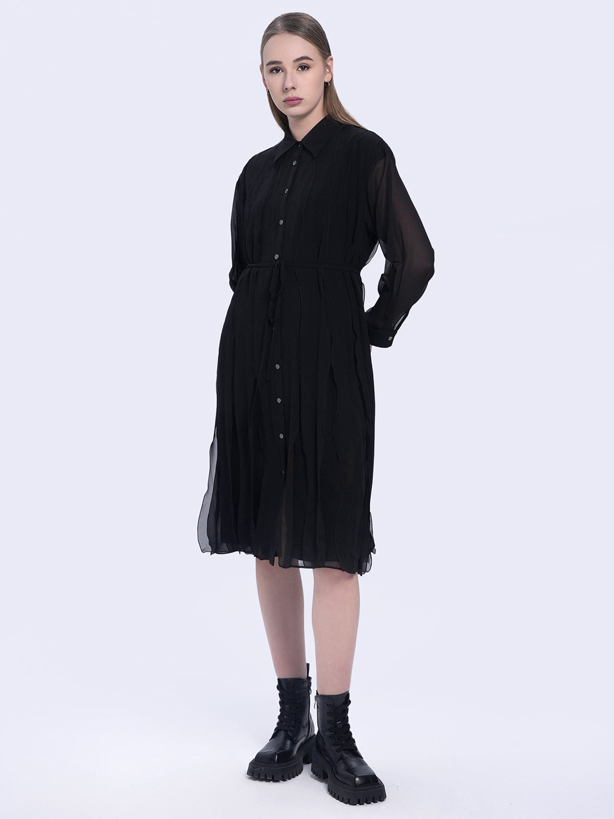 S·DEER black shirt dress, showcasing its flowy pleated silhouette and flattering waistline
