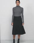 Comfortable Elastic High Waist: Experience comfort and style with the elastic high waist design of this midi skirt.