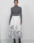 Modern Chic Apparel: White Skirt with Silver Print Detail for Fashion Enthusiasts