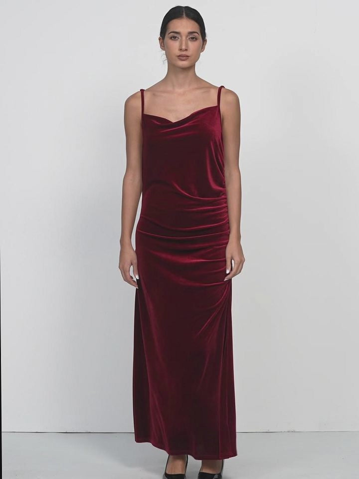 Velvet spaghetti strap maxi dress with irregular V-neck and pleated detailing, suitable for various occasions