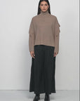 Versatile Solid-Colored Sweater with High Neck and Special Sleeve Design